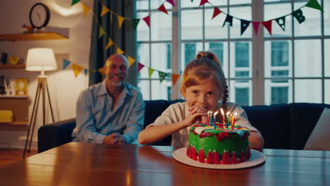 girl making a wish on her birthday