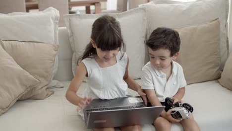 focused young girl using laptop by herself