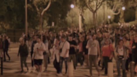 blurred crowd walking at night