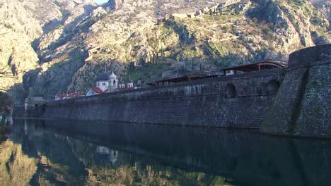 Old-walls-of-town-of-Kotor,-mediterranean-harbor-and-town-in-Adriatic-sea