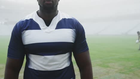 male rugby player standing in stadium 4k