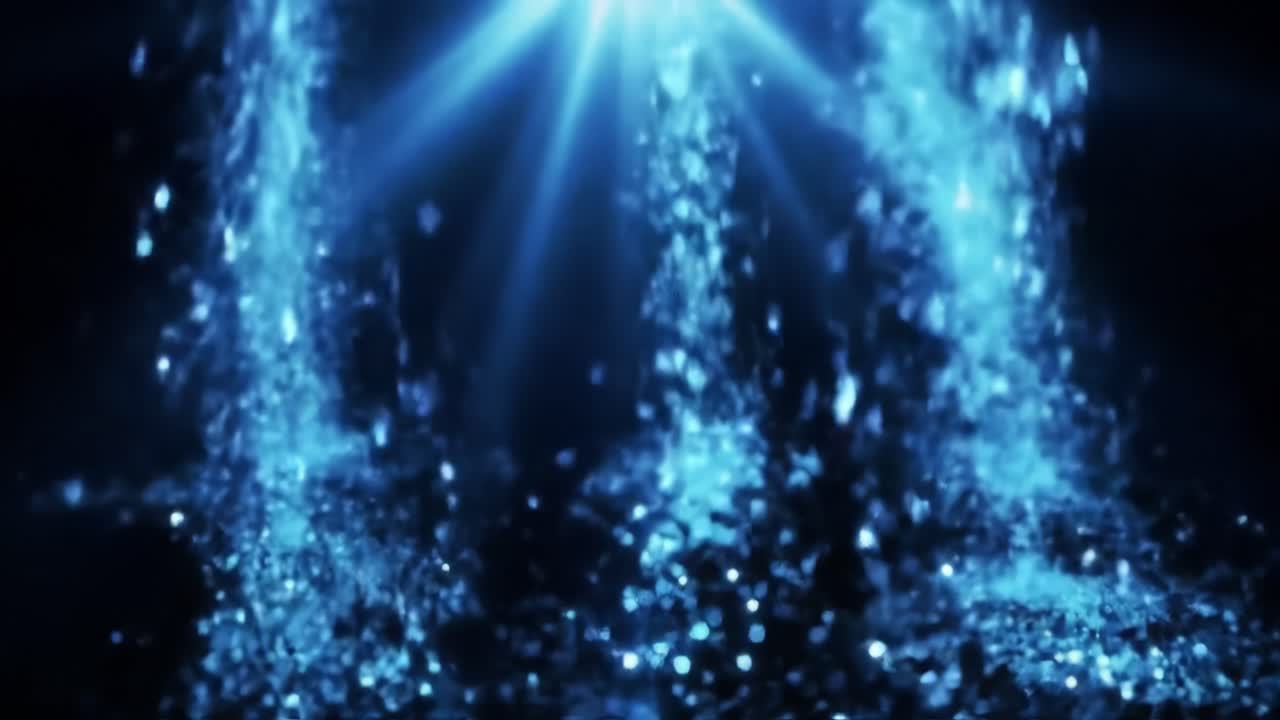 Captivating visual display of shimmering water droplets dancing in blue light against a dark backdrop. The dynamic movement creates an enchanting atmosphere.