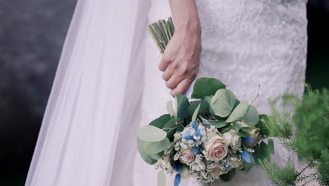 elegant bridal bouquet in white gown