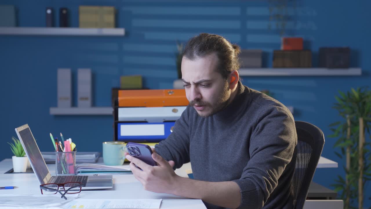 Happy young man discovering new features.