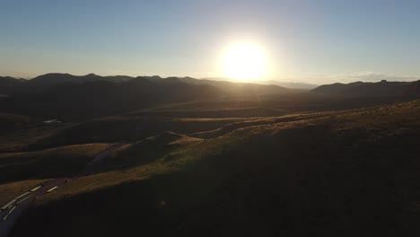 aerial shot of mountains in chihuahua with the sun behind