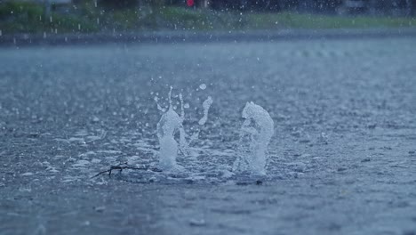 intense downpour forces water to erupt from drain like urban street geyser