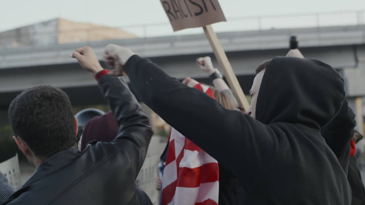 Protest with American Flag and Raised Fists