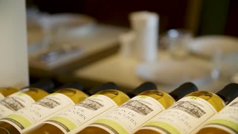 wine bottles on a display in a restaurant