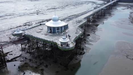 Bangor-Garth-pier-Victorian-ornamental-silver-dome-pavilion-landmark-tourist-aerial-view-seaside-attraction-slow-left-low-orbit