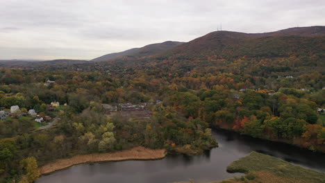 a high angle drone shot of the colorful fall foliage in upstate ny