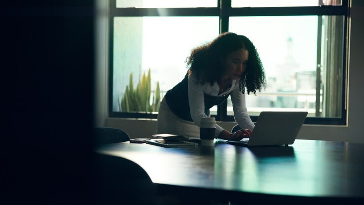 Woman working on laptop in office