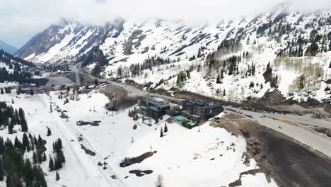 Aerial-View-of-Snowy-Utah-Canyon-in-Winter,-Ski-Resort-in-the-Mountains