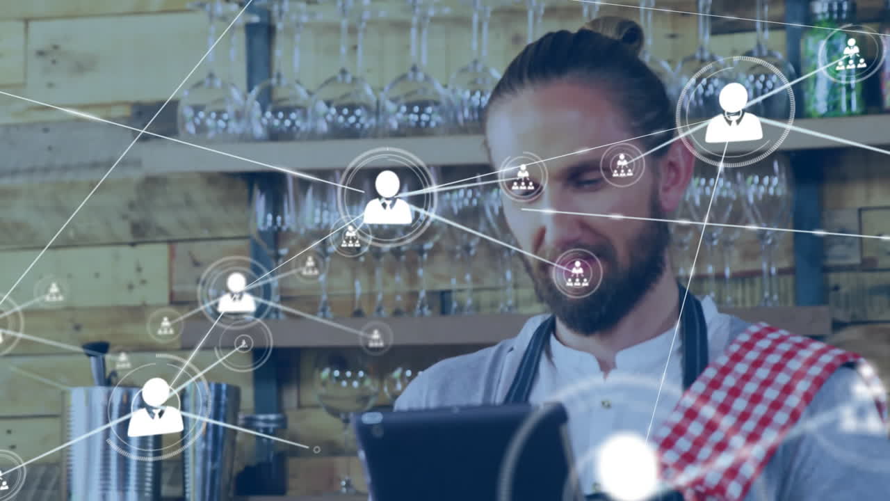 Animation of network of connections with people icons over caucasian man with tablet
