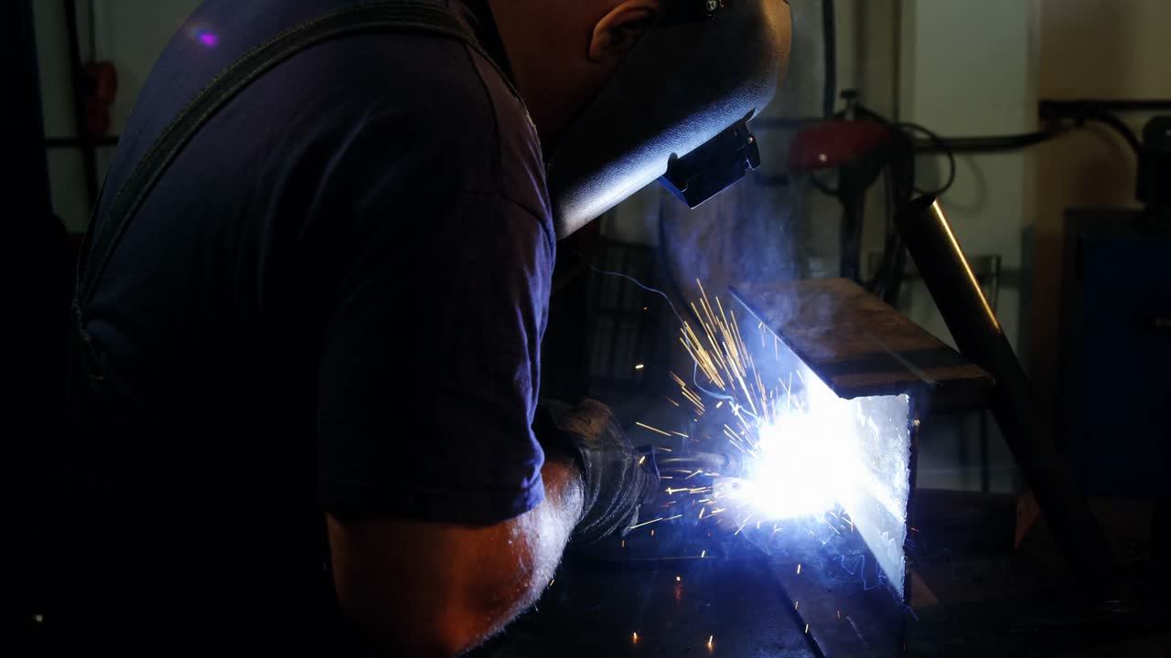 Welder welding a metal