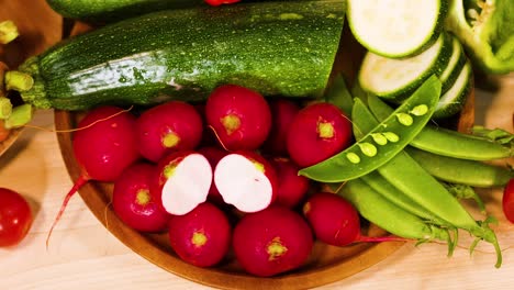 assorted vegetables displayed on a black background