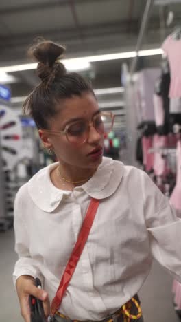 woman shopping for dance clothes in a store