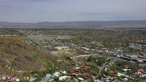 aerial panorama of palm springs, california revealing mountains and cityscape