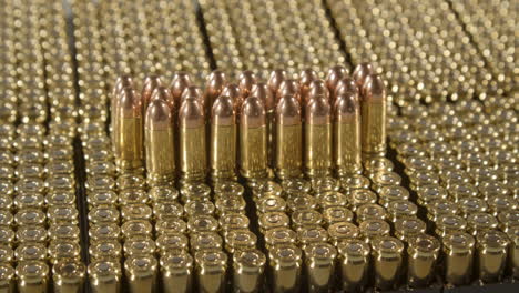 dolly out of 9 millimeter bullets standing on loads of new ammunition