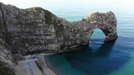 aerial over beach with view of durdle door in dorset