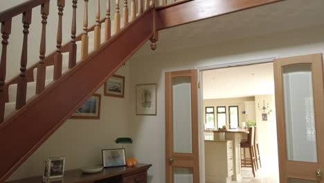 tilt shot of an entrance hall and staircase in a rural home