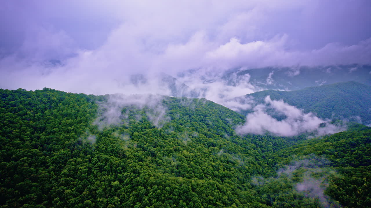Cinematic aerial pass above misty Smoky Mountain ridges