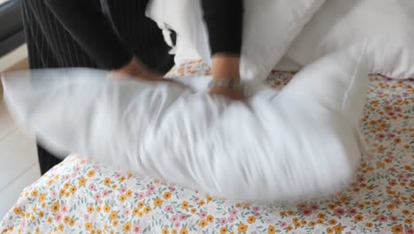 woman making a bed