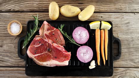 Marinated-steak-and-ingredients-on-grill-tray