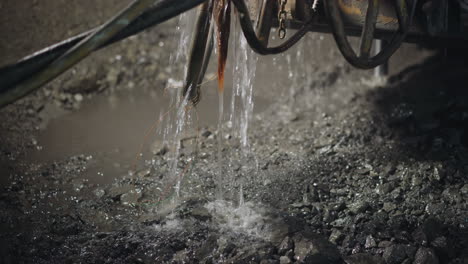 Cold-water-flows-down-cooling-rocks-during-drilling-process