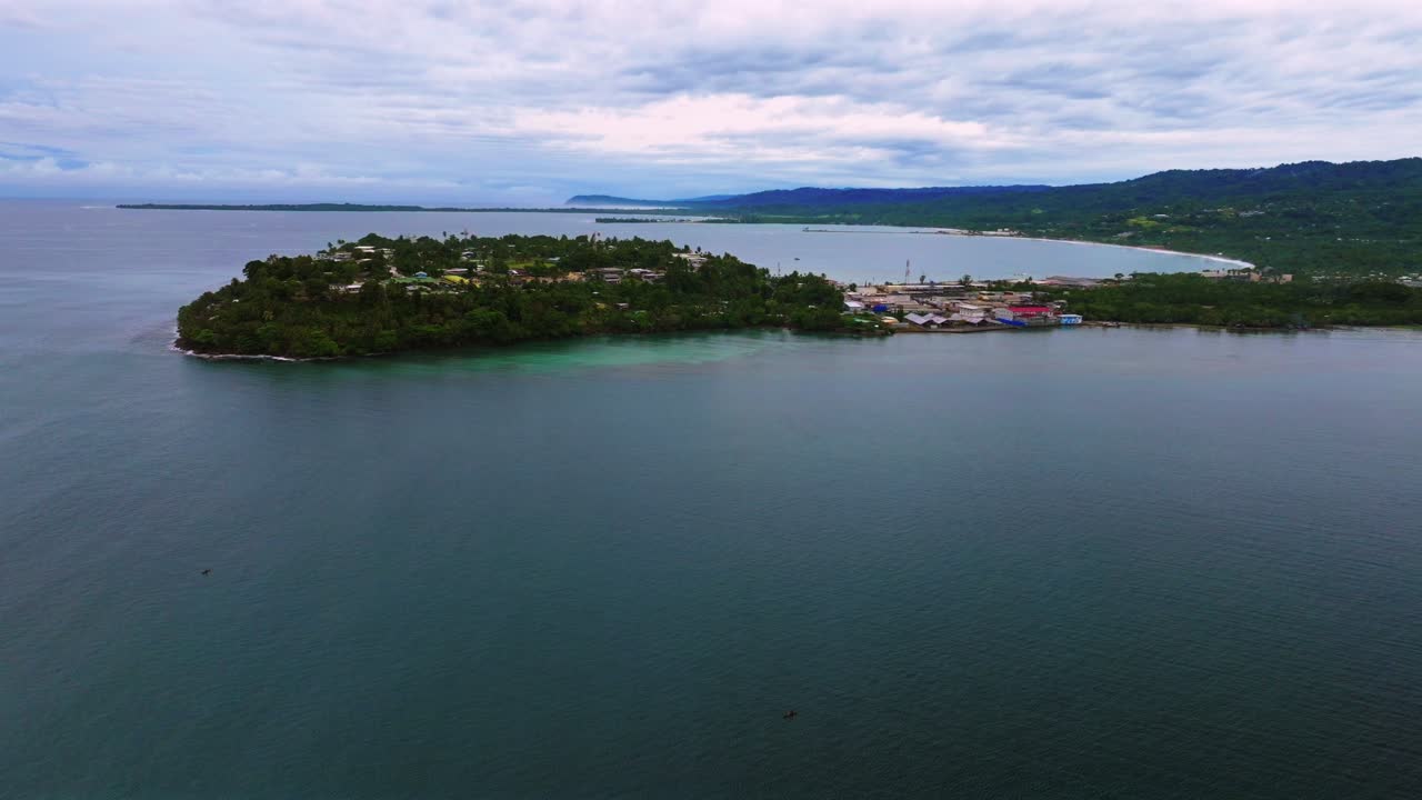 Cloudy morning Wewak Papua New Guinea aerial drone PNG summer dry season Boram Road cape Wewak Hill costal town Wewak Seawall Port Dogreto Bay mini beach Sundaun Market circle left motion