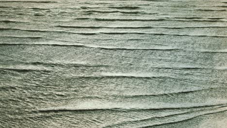 series of ocean waves rolling in the beach due to strong wind by storm francis in sardinia