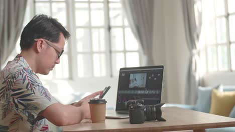 Man editing photos and videos at home