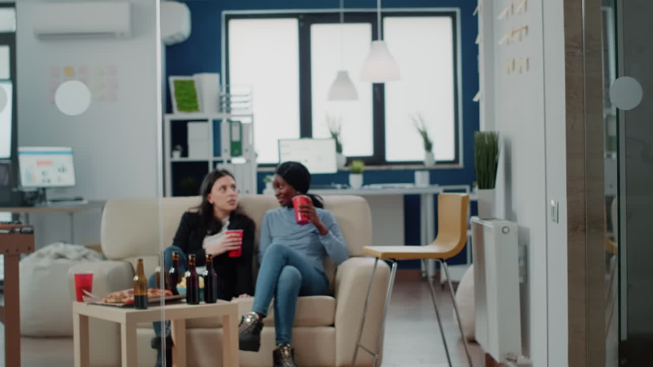 Workmates enjoying free time after work with office chair