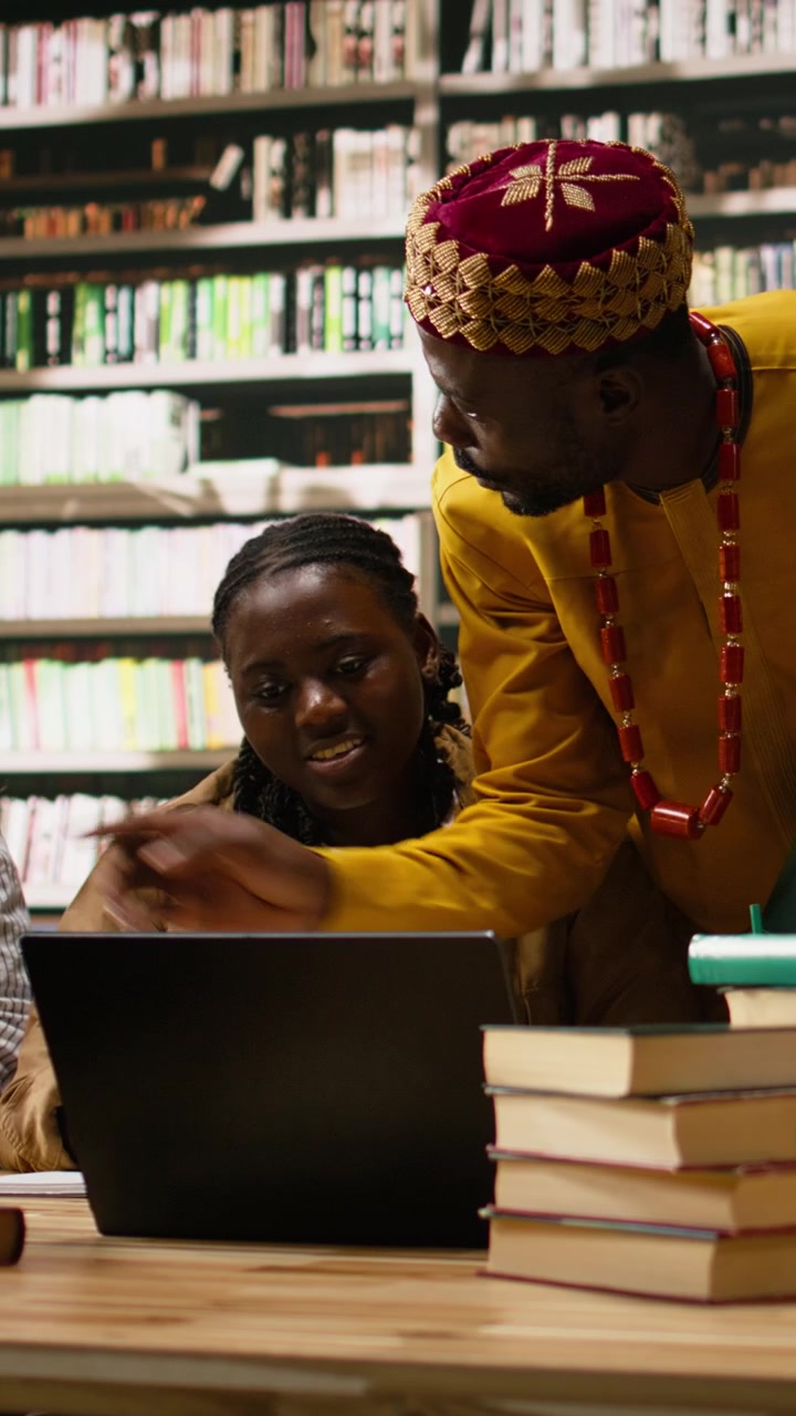 Vertical Video Diverse Classmates In Group Study Gather Around Laptop With Study Materials