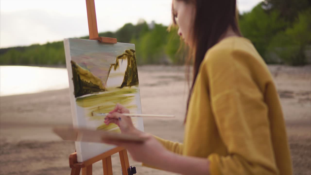 Woman Painting Landscape on a Beach
