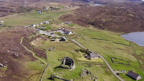 Descending-drone-shot-of-the-'Dun-Carloway-Broch'-on-the-west-coast-of-the-Isle-of-Lewis,-part-of-the-Outer-Hebrides-of-Scotland