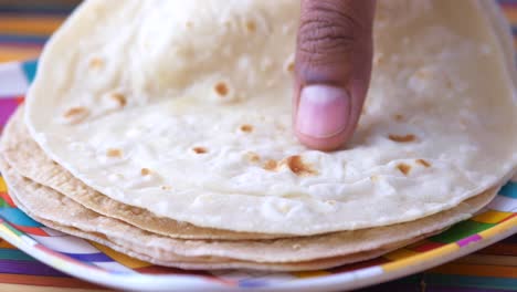 Homemade-roti-chapati-on-table-,