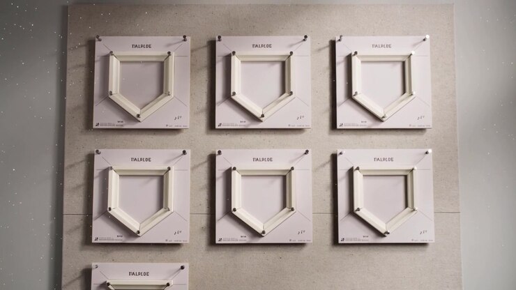Shifting camera stabilizing to center nine white panels in gallery, with U-shaped hinges and screws