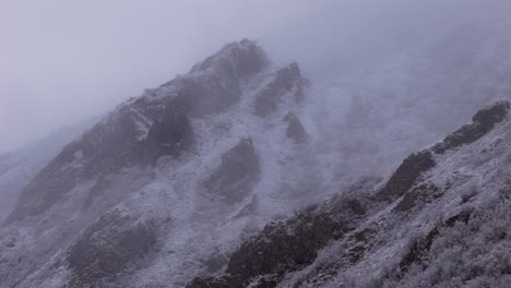 close-up view of snow-capped ogilvie mountains during winter in yukon, canada. panning shot