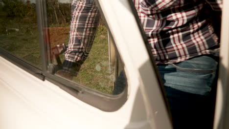 Girlfriend-opening-the-door-of-retro-camper-van