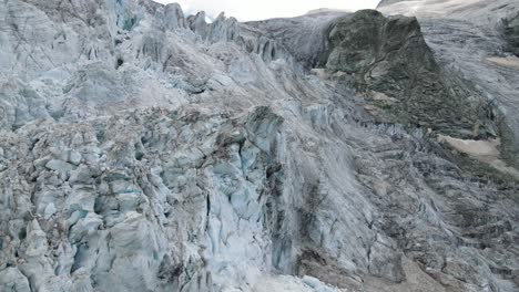 moiry glacier in switzerland with rugged icy terrain and rocky landscape