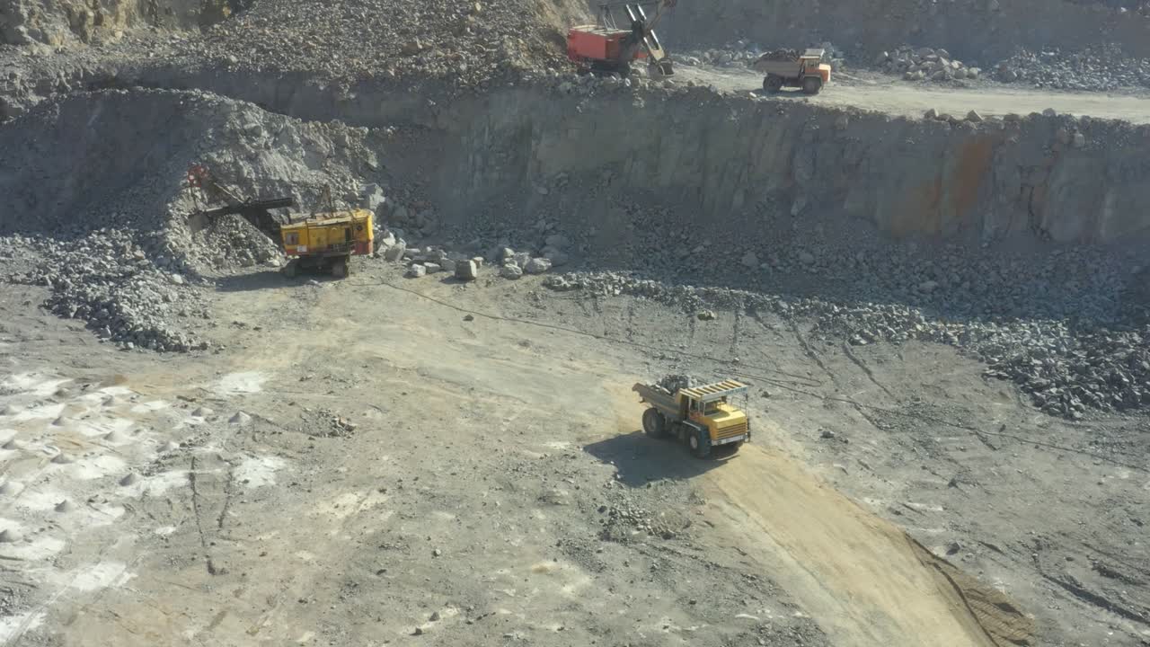 Granite quarry. Extraction of granite. Open cast mine. Mining industry. Stone Quarrying - Aerial view