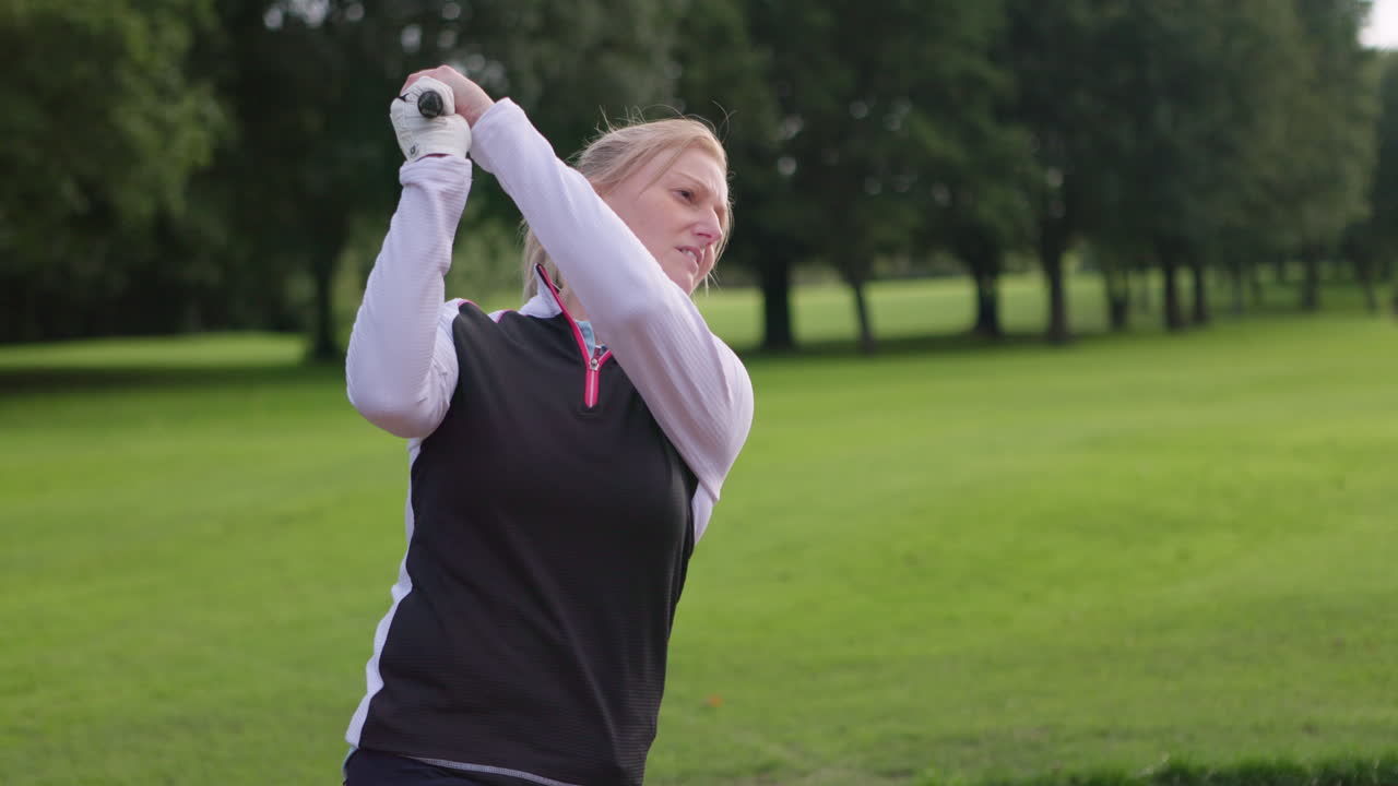 Woman playing golf on a golf course