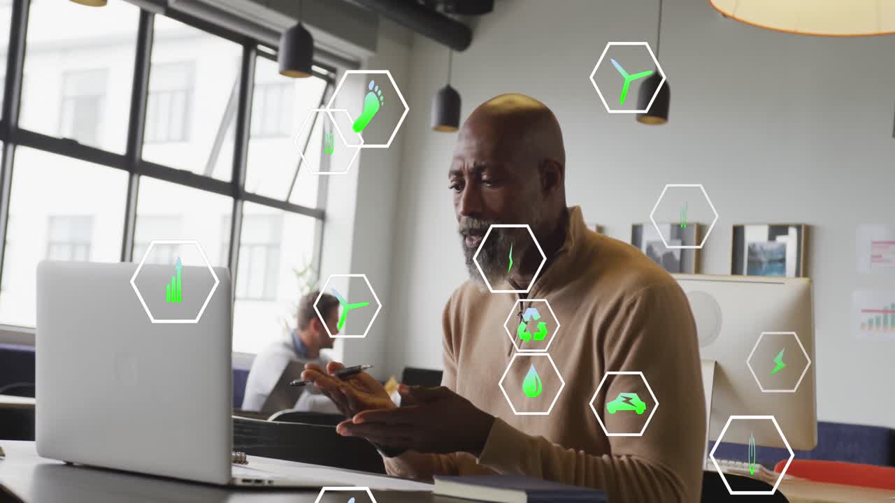 Animation of icons and data processing over african american businessman in office