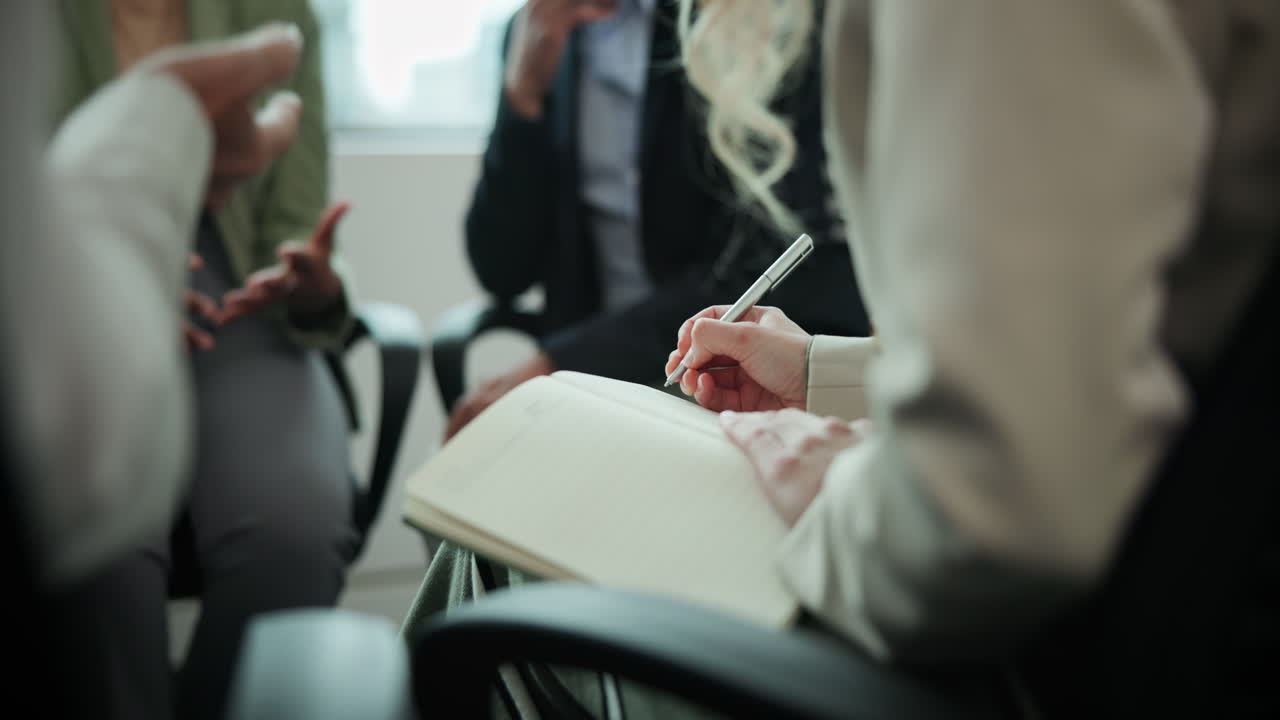 Business meeting with note-taking