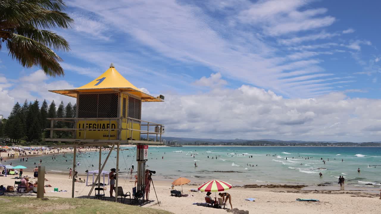 Lifeguard tower overseeing a crowded beach