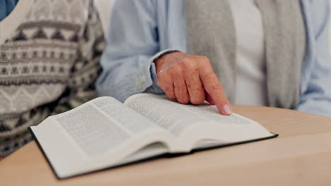 Man,-hand-and-bible-study-on-table-with-priest