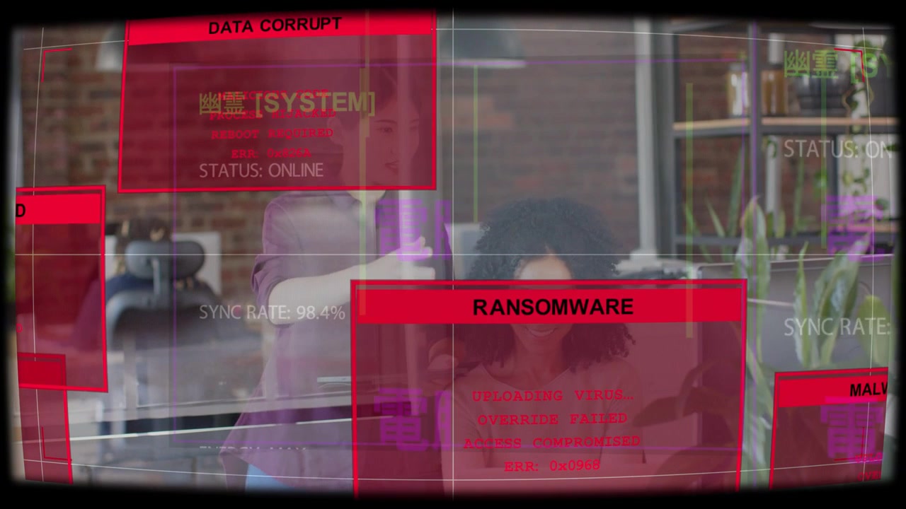 Standing and seated team responding at laptop in office, HUD appearing and showing security alerts