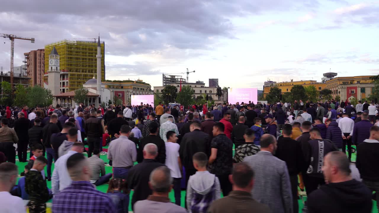 Large Crowd Gathered in Urban Setting