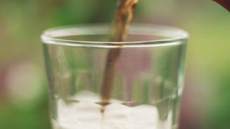 filling up glass of coke