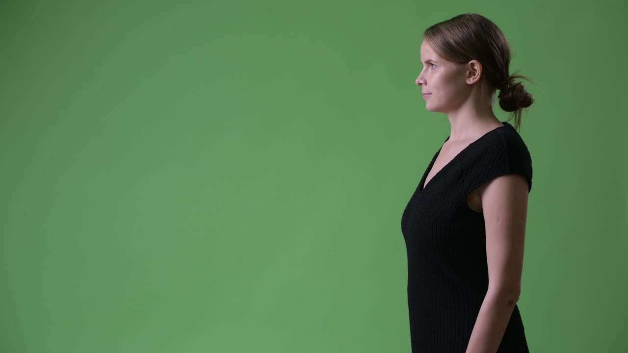 Profile view of young beautiful businesswoman with blond hair